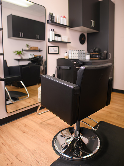 black leather ergonomic hair styling chair